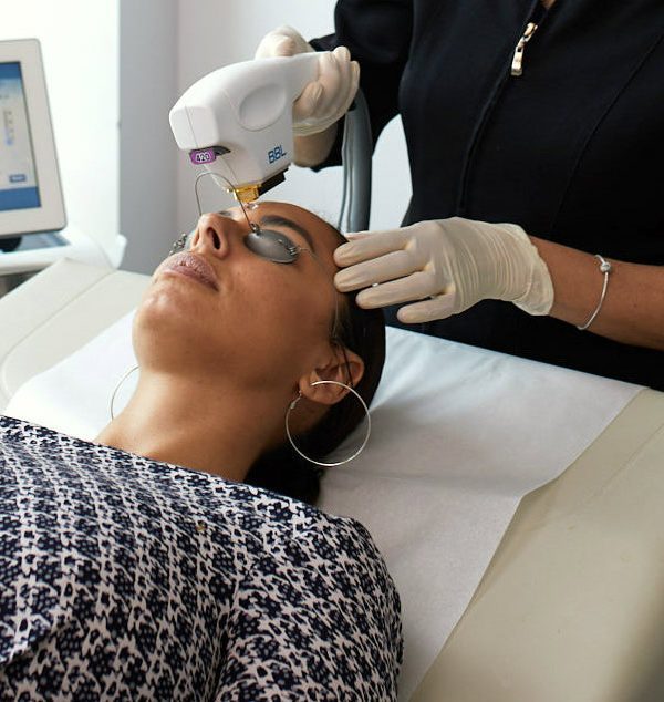 Woman receiving skin treatment