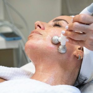 Bela MD medical-grade treatment on a woman's face