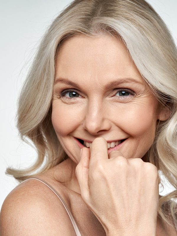 Mature woman with healthy and glowy skin